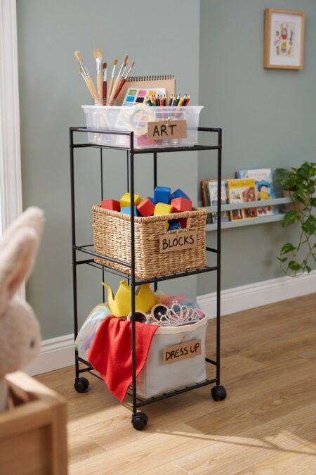 black rolling cart with art supplies, building blocks, and dress-up clothes