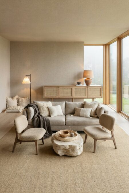 Japandi living room with floor-to-ceiling windows, textured wallpaper, a linen sofa, a charcoal wool throw, cushions in boucle and cotton, and a floor nook in the corner