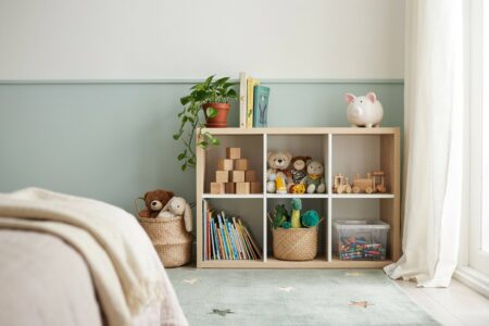 kids' bedroom has a cube storage organizer with toys